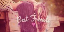 Best friends hugging with their heads resting on a wooden box, showcasing friendship and warmth.